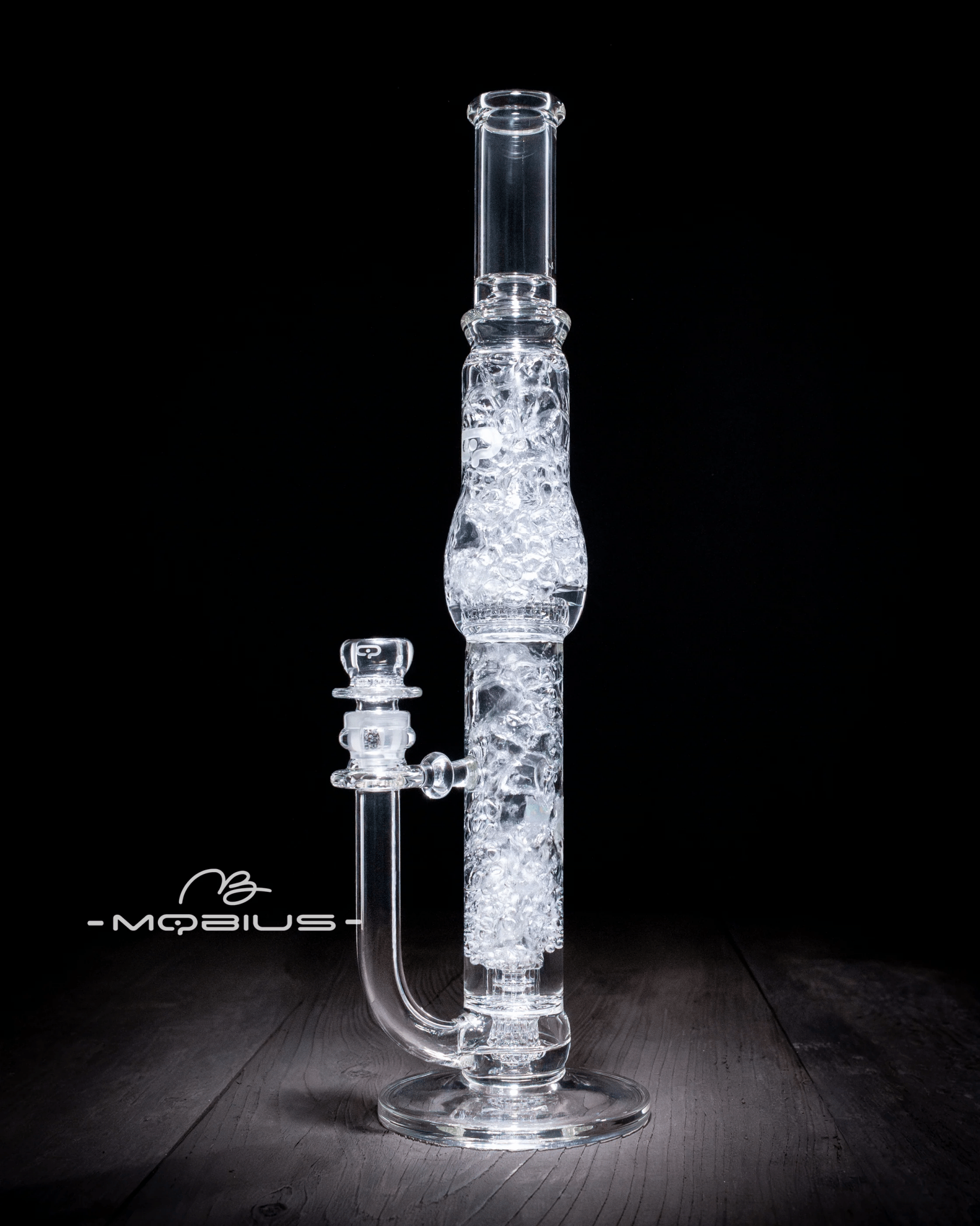 Glass waterpipe featuring a 45T Tall Stereo Matrix and Matrix Splash Trap V1 by Mobius, with intricate glasswork and detailed design.