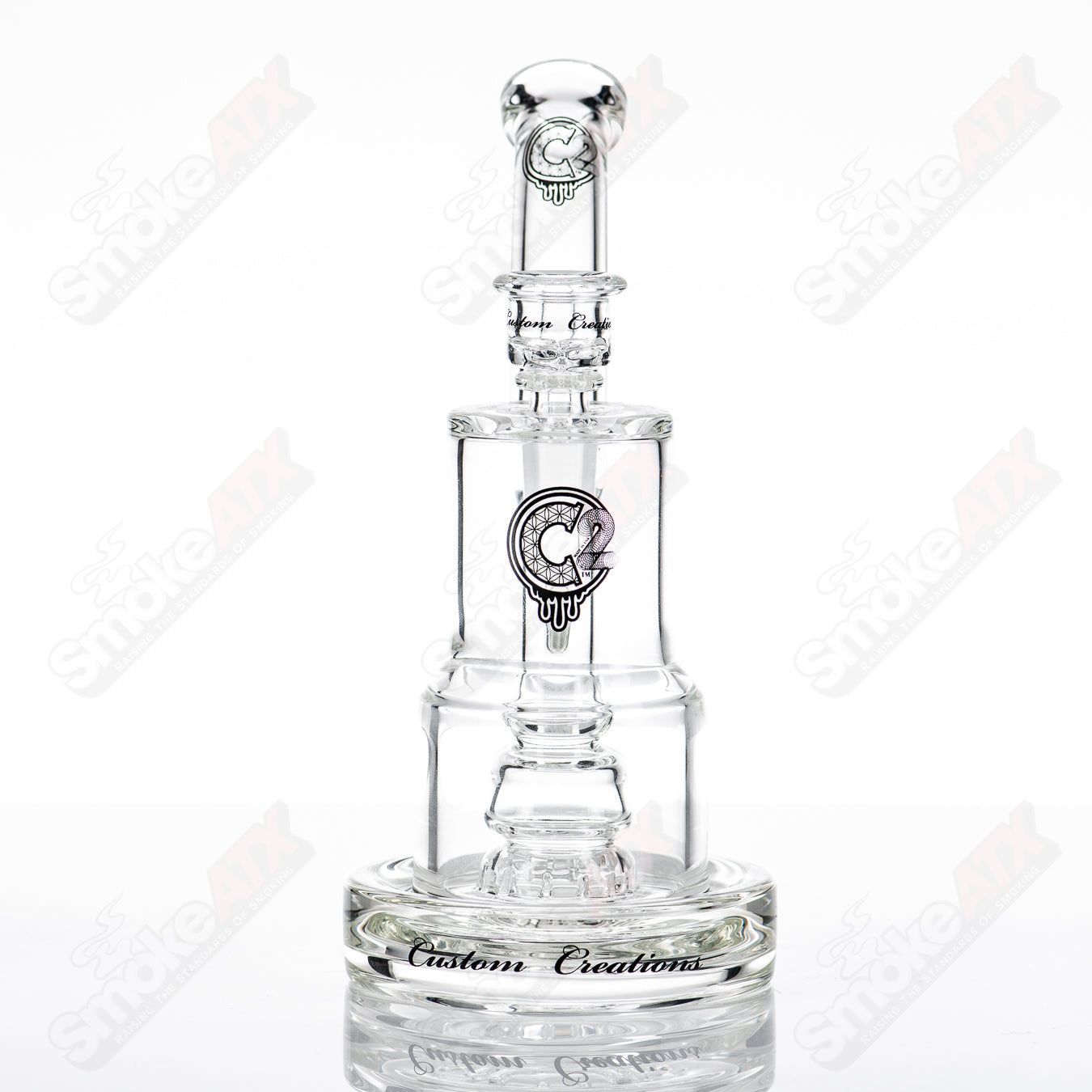 C2 Custom Creations glass waterpipe with 50mm to 80mm fixed sprocket perc bubble chamber, detailed glass design.
