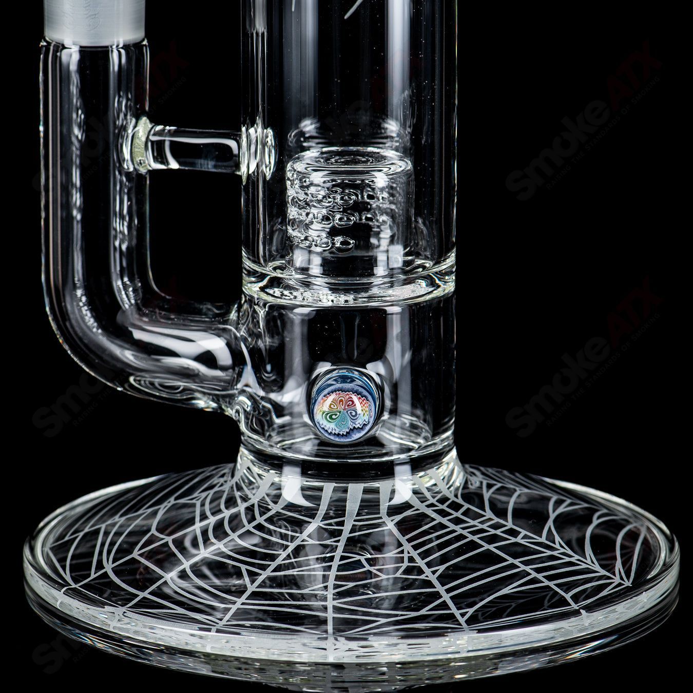Clear Sovereignty Glass straight tube with 50x5 grid cap, featuring Millie and Halloween pattern designs.