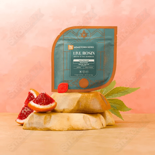 Hometown Hero Blood Orange Live Rosin D9+CBD Gummies, hemp edibles with 5mg THC and CBD, showing a vibrant blood orange flavor.