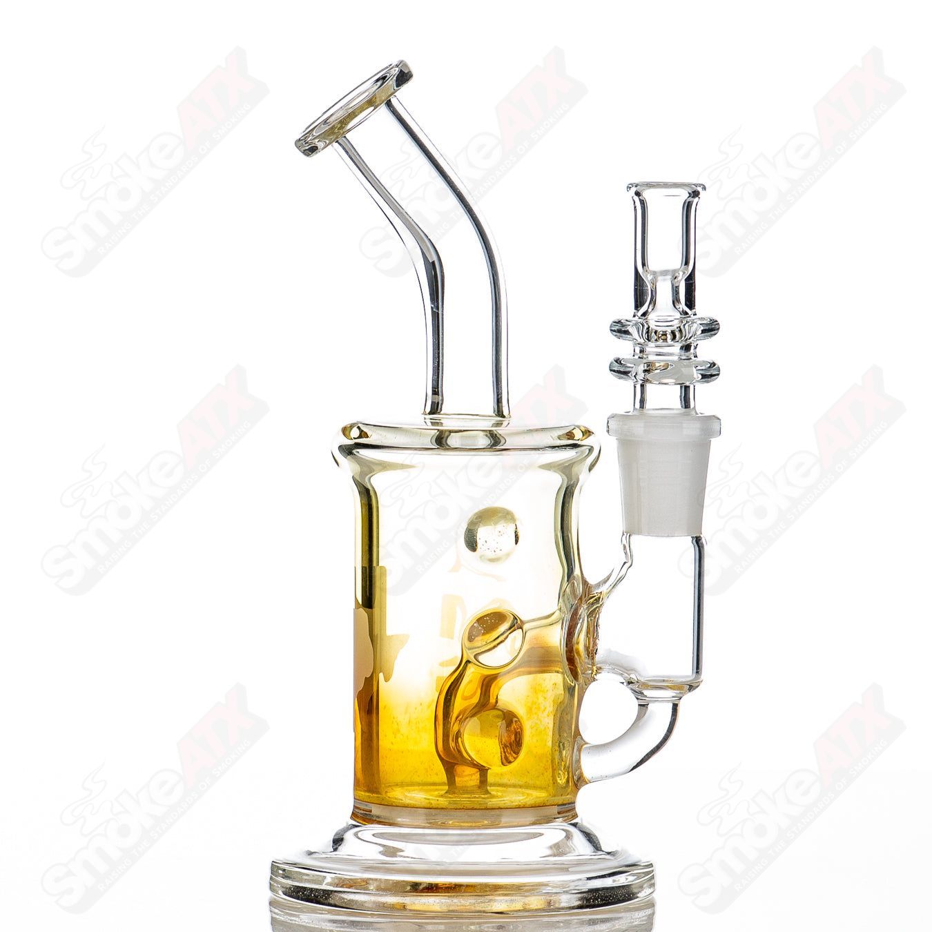 Gold fumed 6-inch 44mm glass shredder rig by Austin Made Glass Co, designed for concentrates with intricate fumed detailing.