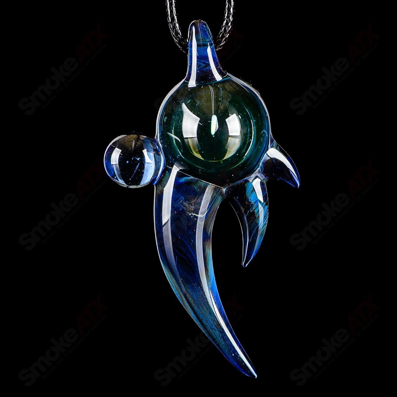 Dosh Glass #6 Amulet Pendant made of colorful Dosh Glass, featuring intricate designs and a polished glass finish.
