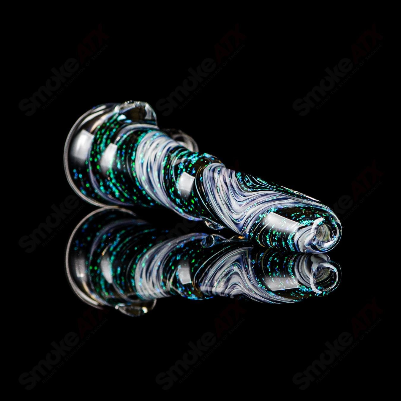 Glass chillum Hitter with #6 opal design by Rotational Science, featuring a colorful, smooth glass body and compact shape.