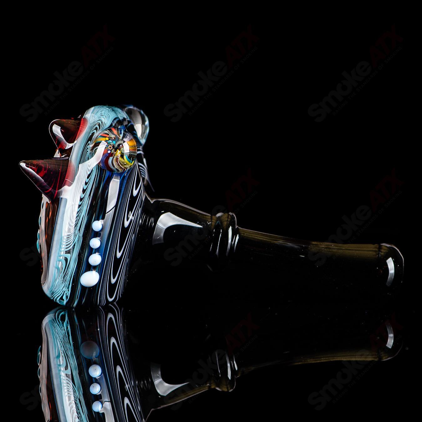 Six JMass heady glass spoon pipes with black mouthpieces, featuring a sleek design and clear glass construction.
