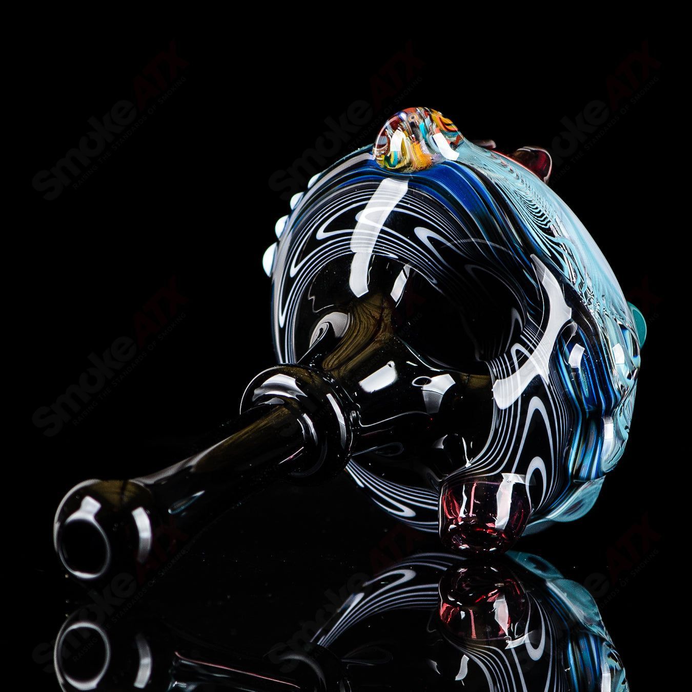 Six-piece set of JMass Heady Glass spoons with black mouthpieces, showcasing intricate glass design and craftsmanship.