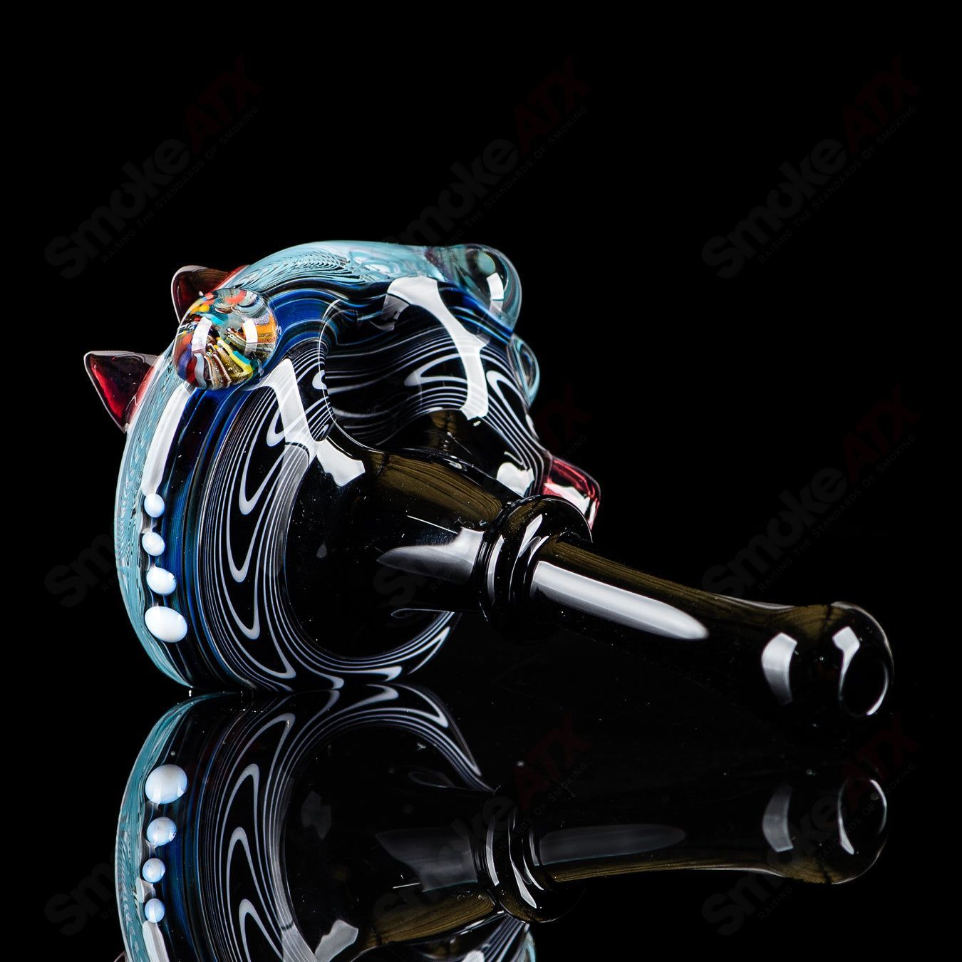 Set of six JMass heady glass spoons with black mouthpieces, showcasing colorful, artistic hand pipes for smoking.