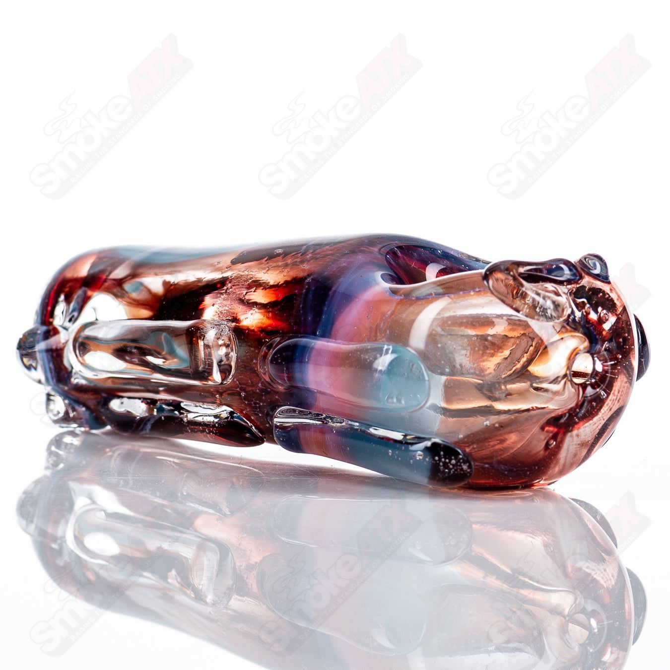 Glass pipe called Spoon Glass by Nobody, clear transparent glass with a rounded bowl and long stem design.