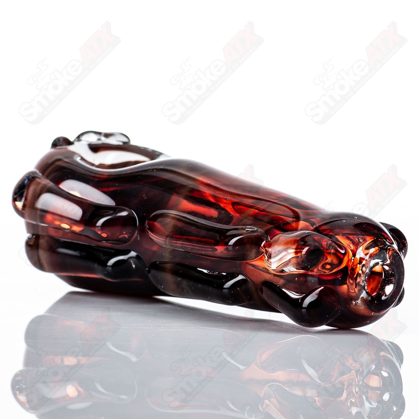 Clear glass spoon pipe by Nobody, featuring a smooth bowl and elongated stem, designed for smoking purposes.
