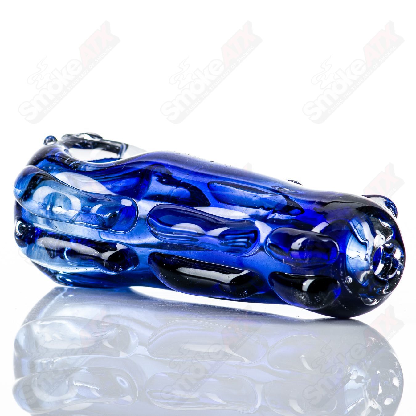 Clear glass spoon pipe with a rounded bowl and straight stem, designed by Nobody for smooth smoking sessions.