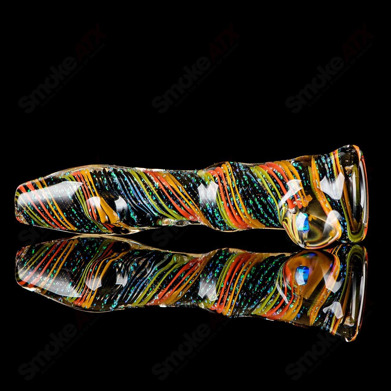 Glass chillum named #7 Opal Hitter by Rotational Science, featuring a colorful opal design and compact, smooth glass construction.