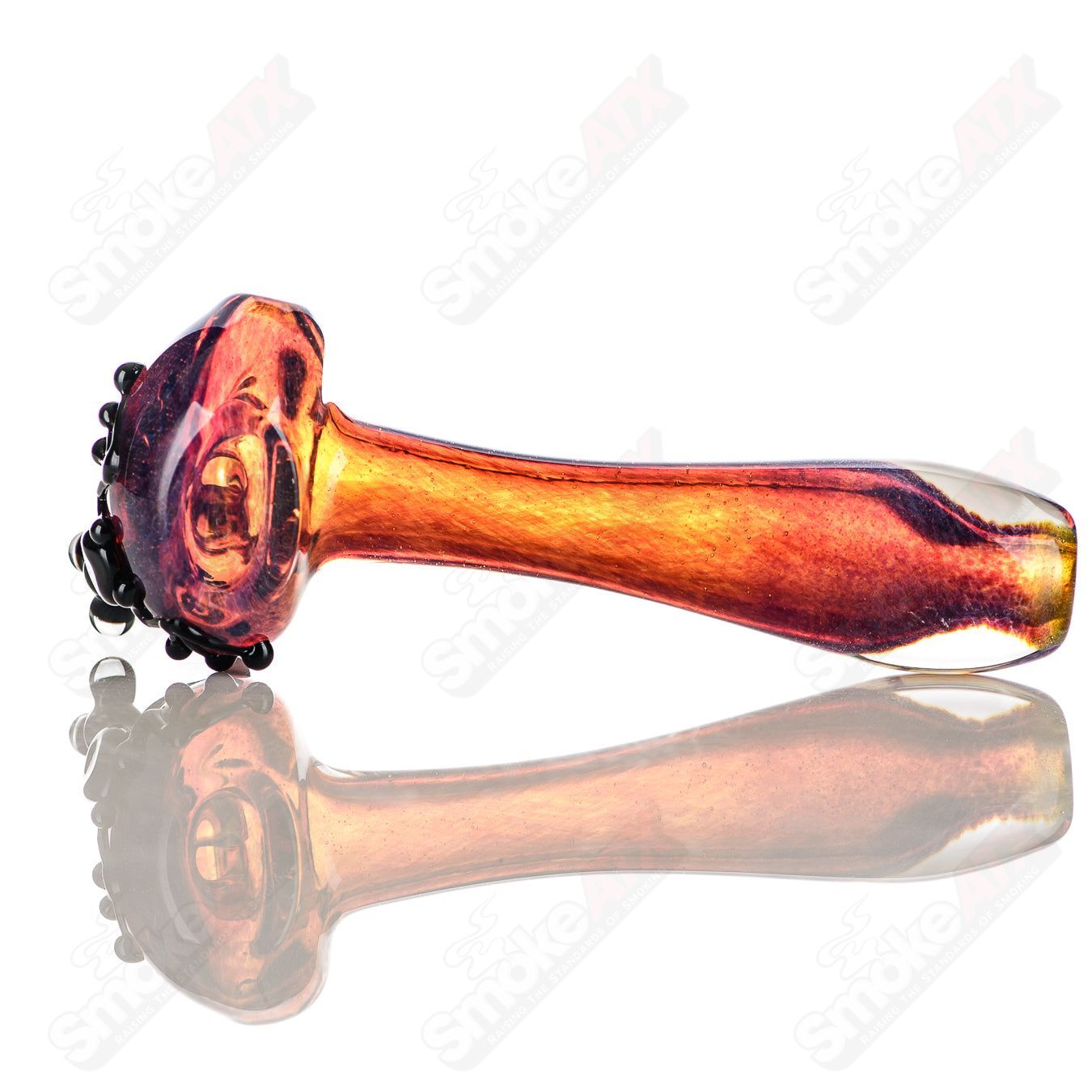 Beezy Glass #8 Frog Spoon pipe made of clear glass with a detailed frog design and curved bowl for smoking.