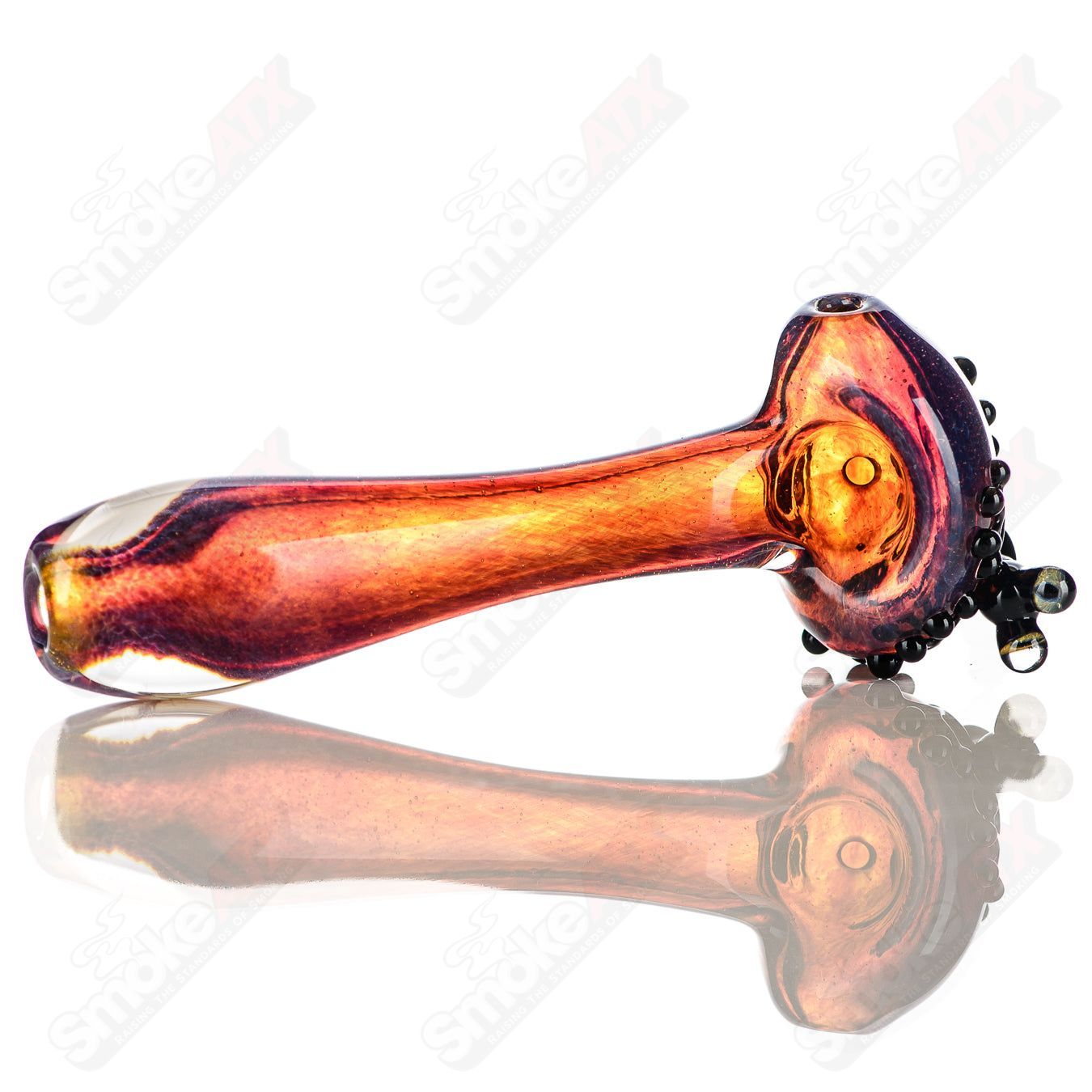 Beezy Glass #8 Frog Spoon pipe made of clear glass with a frog design, featuring a rounded bowl and smooth mouthpiece.