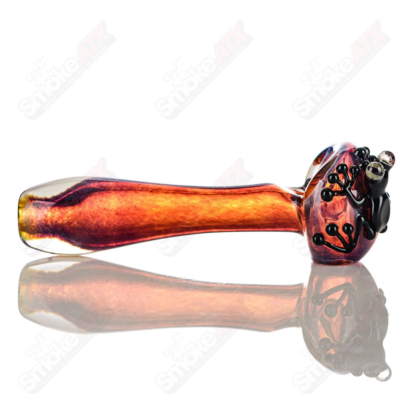 Beezy Glass #8 Frog Spoon pipe made of clear glass with a frog design, featuring a bowl and mouthpiece for smoking.