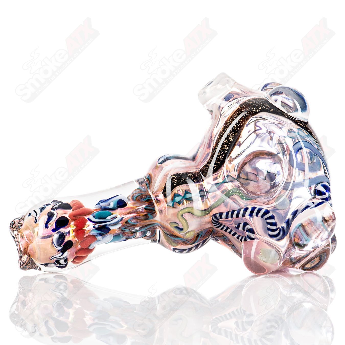 Molten Imagination Custom Glass Creations ISO Chaos Hammer Spoon, vibrant multicolored glass with intricate design detail.