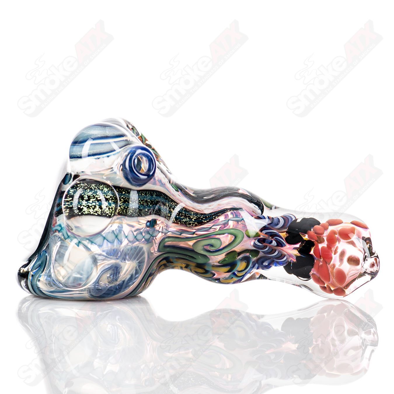 Molten Imagination custom glass Chaos Hammer Spoon featuring vibrant, swirling colors and intricate glass craftsmanship.