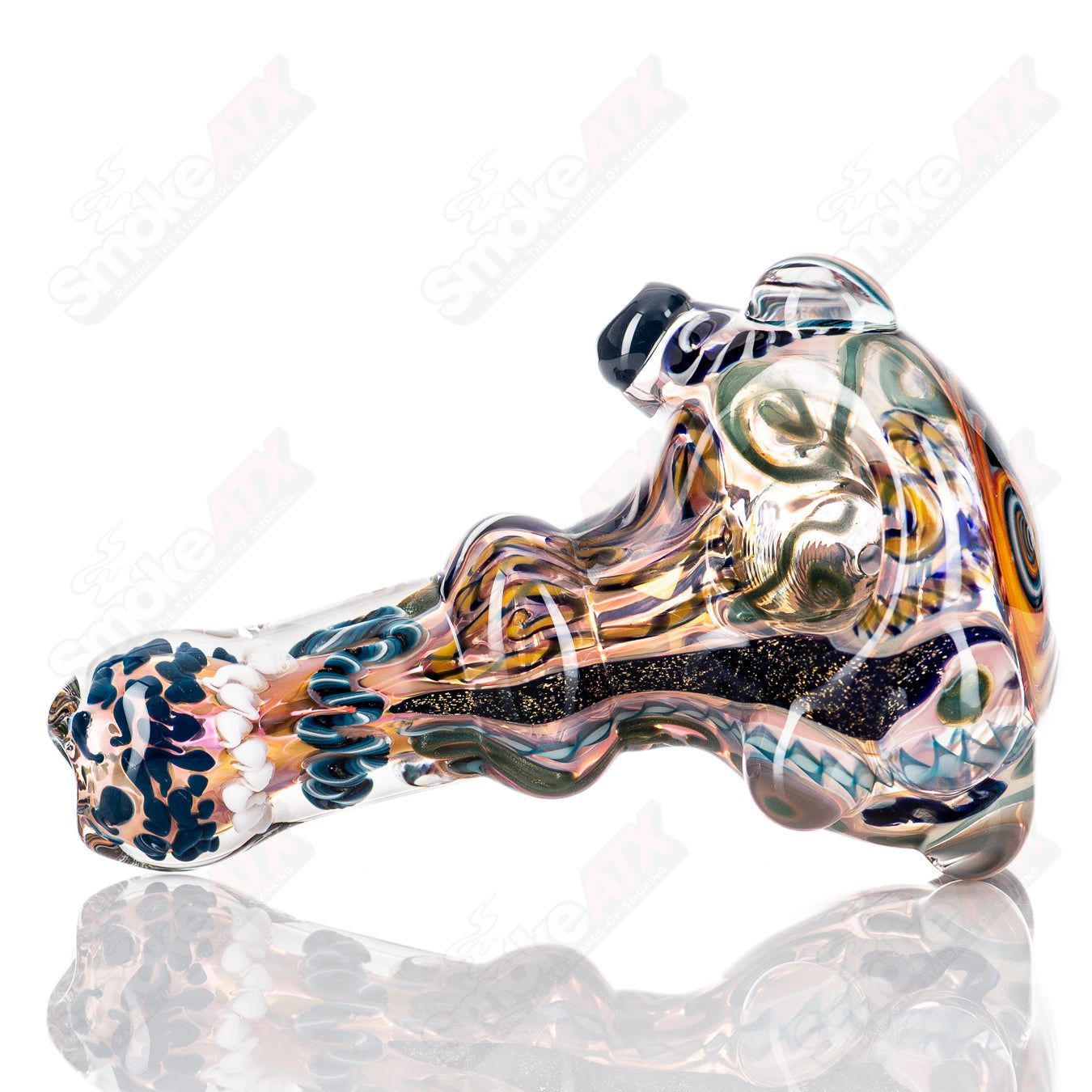 Molten Imagination Custom Glass Creations ISO Chaos Hammer Spoon, hand-blown glass art with vibrant colors and intricate design.