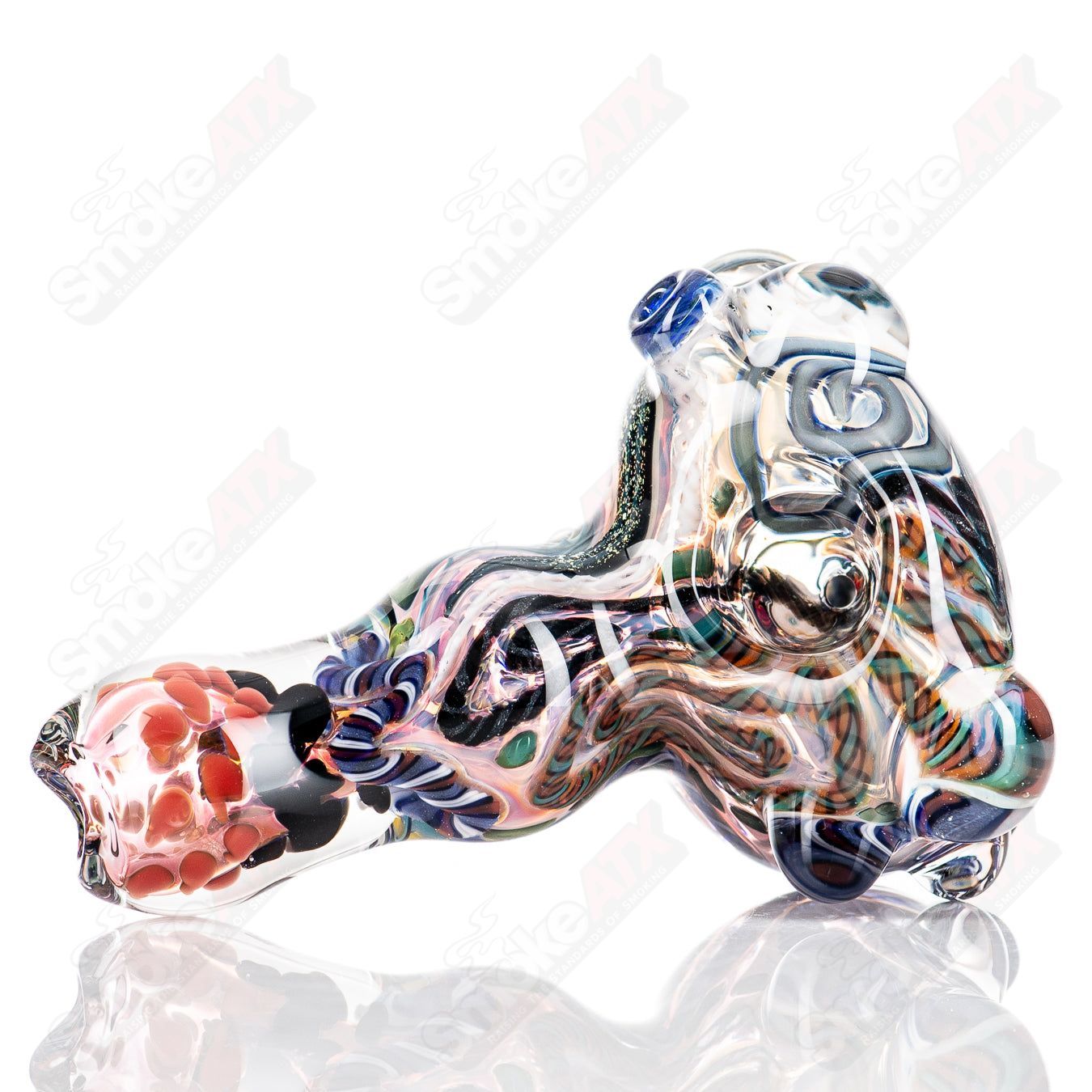 Molten Imagination's ISO Chaos Hammer Spoon, a handcrafted custom glass creation with a unique, vibrant design.