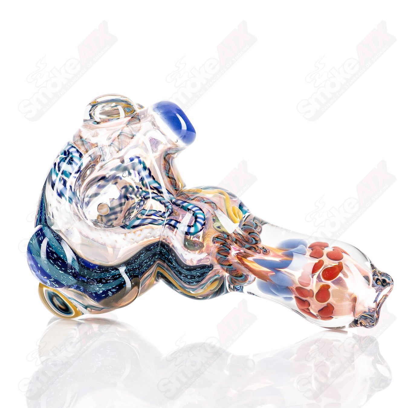 Molten Imagination Custom Glass Creations ISO Chaos Hammer Spoon, vibrant multicolor glass with textured surface detail.