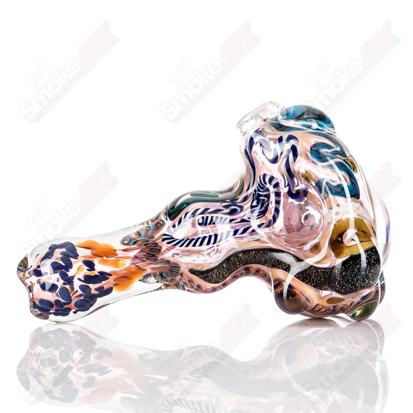 Molten Imagination Custom Glass Creations ISO Chaos Hammer Spoon, hand-crafted glass art with intricate design and vibrant colors.