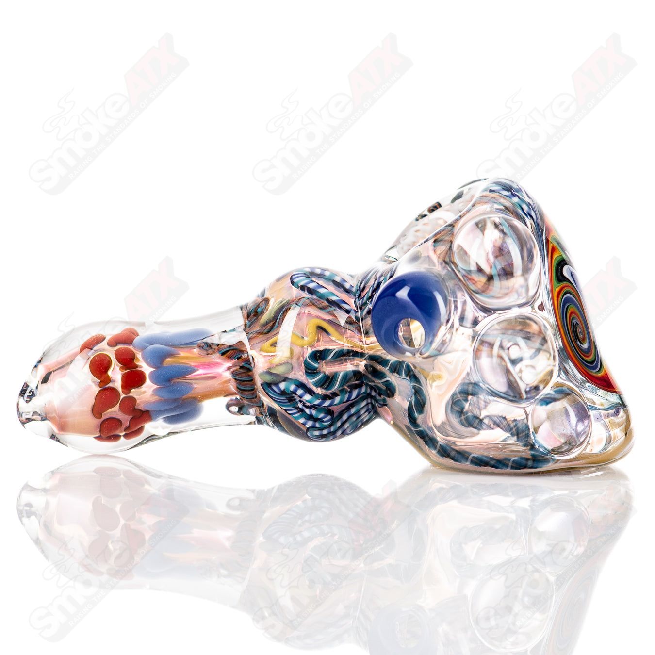 Molten Imagination custom glass Chaos Hammer Spoon featuring a colorful, intricate design with a hammered texture.