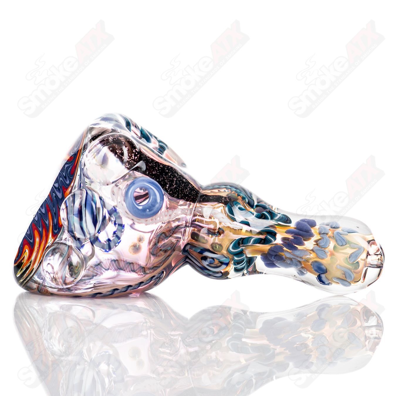 Molten Imagination custom glass Chaos Hammer Spoon featuring vibrant colors and intricate glasswork.