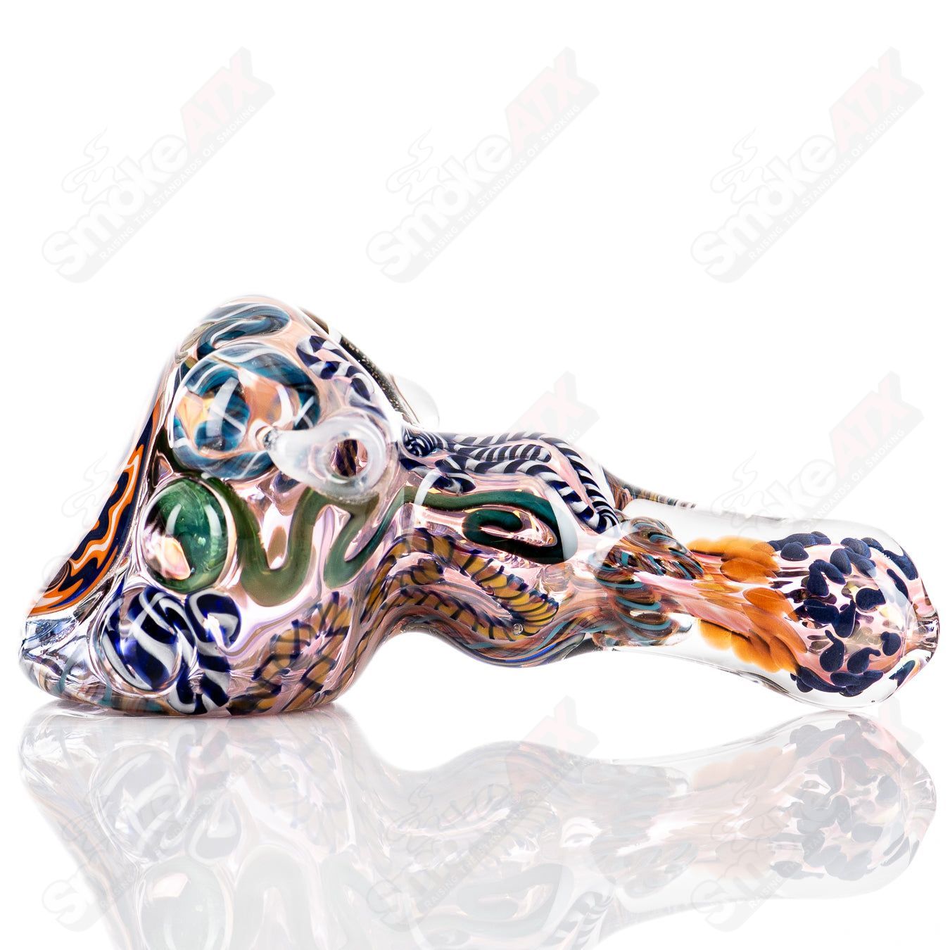 Molten Imagination Custom Glass Creations ISO Chaos Hammer Spoon featuring intricate glass craftsmanship and vibrant colors.