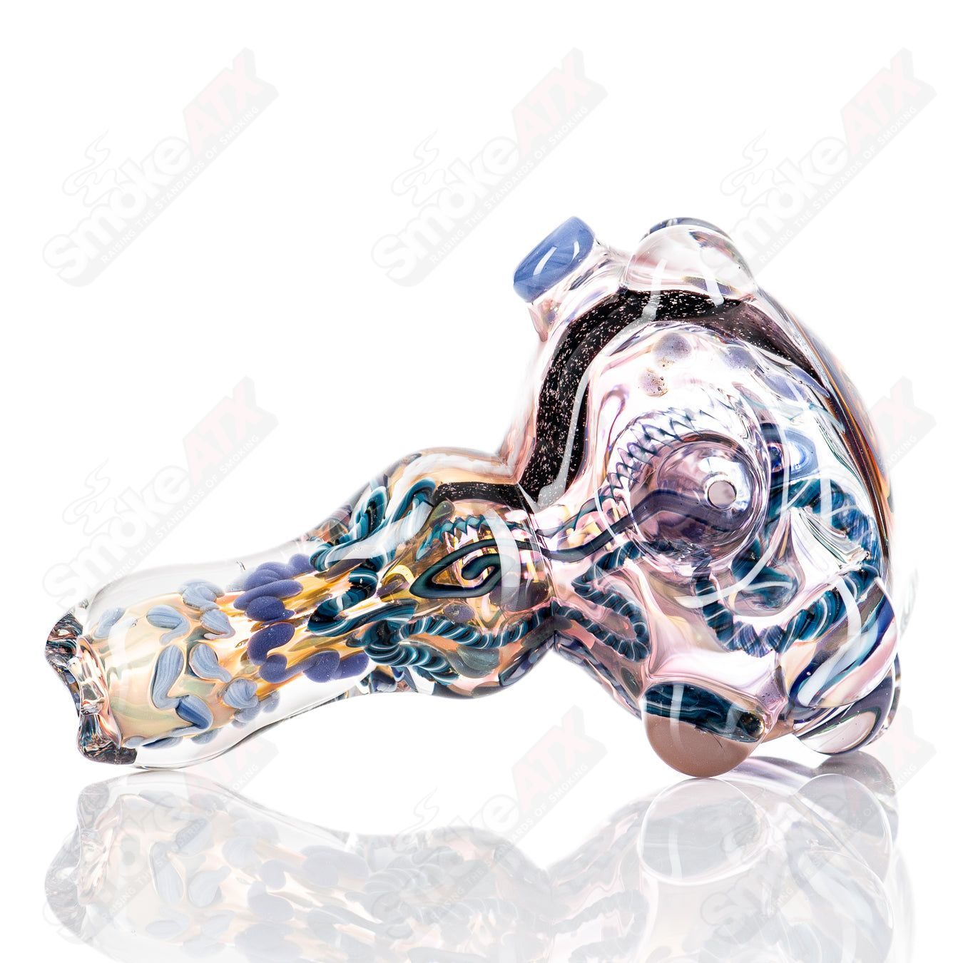 Molten Imagination Custom Glass Creations ISO Chaos Hammer Spoon featuring a colorful, abstract glass design.