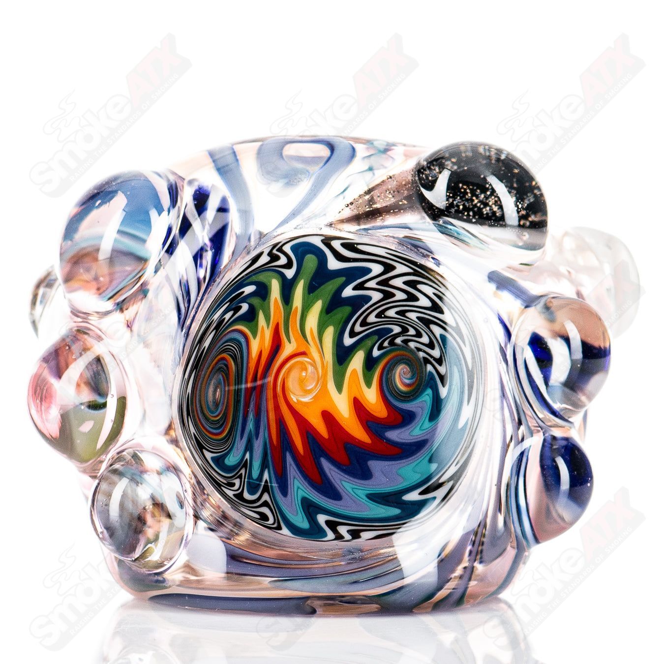 Molten Imagination Custom Glass Creations ISO Chaos Hammer Spoon showcasing a colorful, abstract glass art piece with intricate details.
