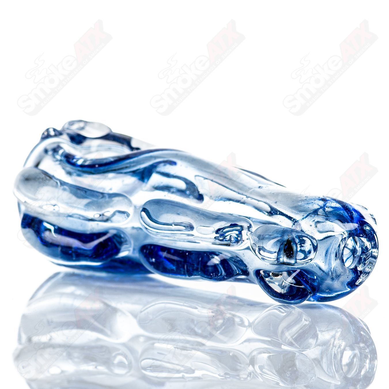 Glass pipe called Spoon Glass by Nobody, featuring a clear, smooth glass design with a rounded bowl and elongated stem.