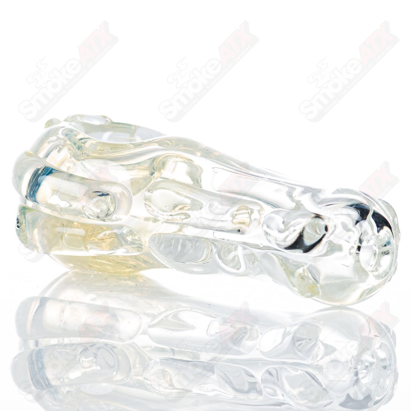 Glass pipe called Spoon Glass by Nobody, featuring a smooth, clear glass design with a rounded bowl and elongated stem.