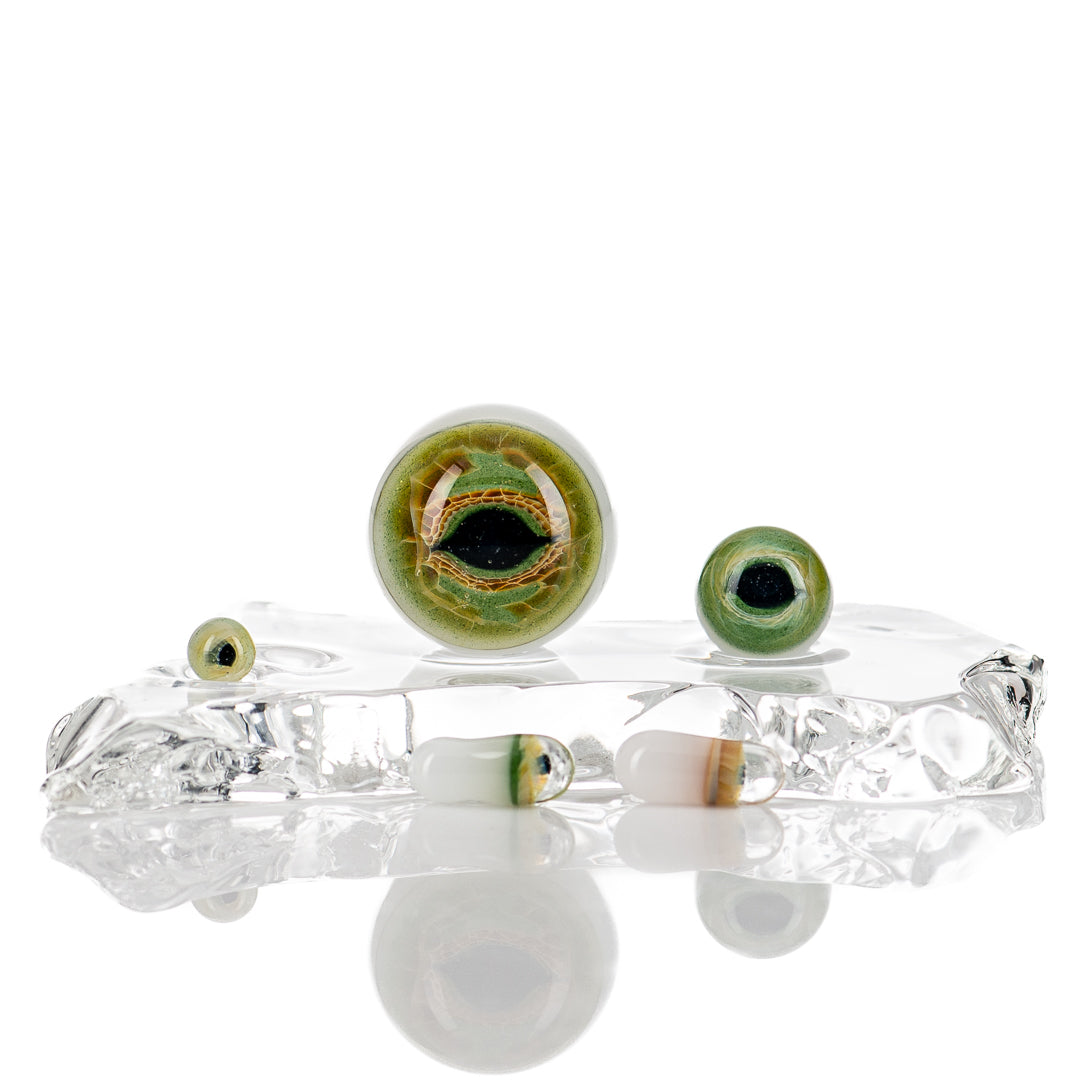 Indo Glass Dragon Eye Slurper Set featuring colorful glass pieces and mouthpiece, designed for flavorful dabbing experiences.