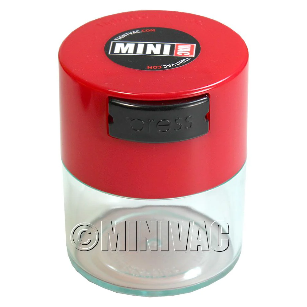 Mini TightVac Storage Container in clear plastic with black lid, 1.4oz capacity, designed for airtight food storage.