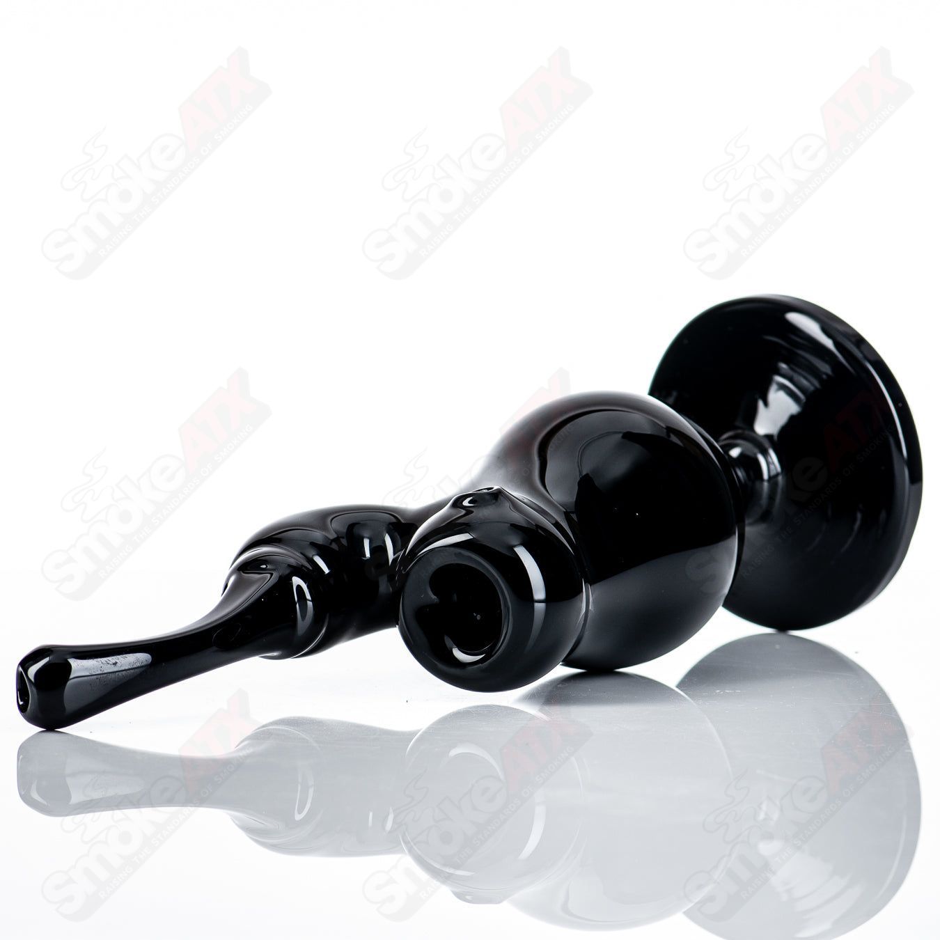 All-black Sherly Bubbler by JMass, a heady glass concentrate rig with a sleek, modern design and clear glass accents.