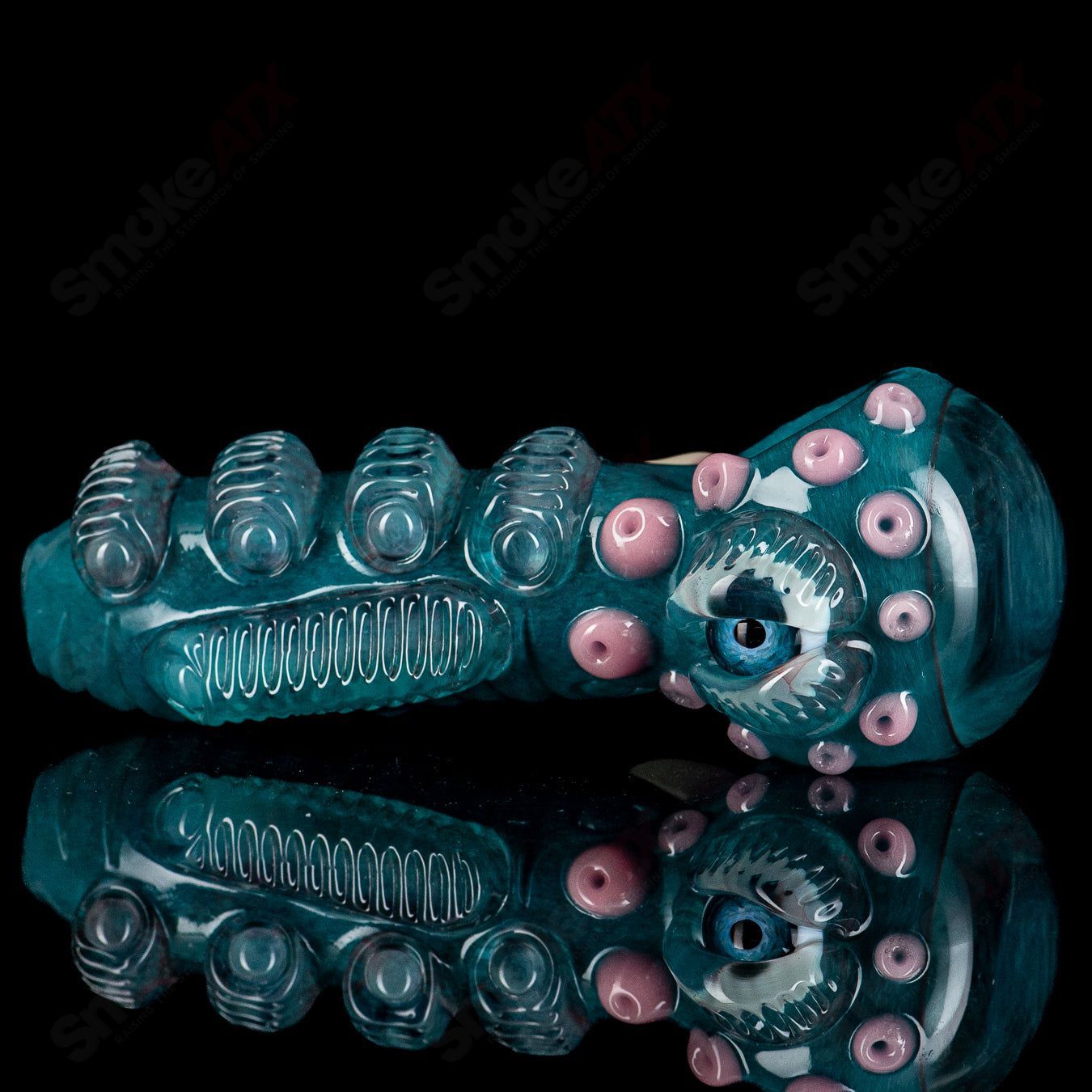Aqua Azul Ether Spoon by Salt Glass, a colorful hand pipe with a smooth glass finish, designed for aromatic herbal use.