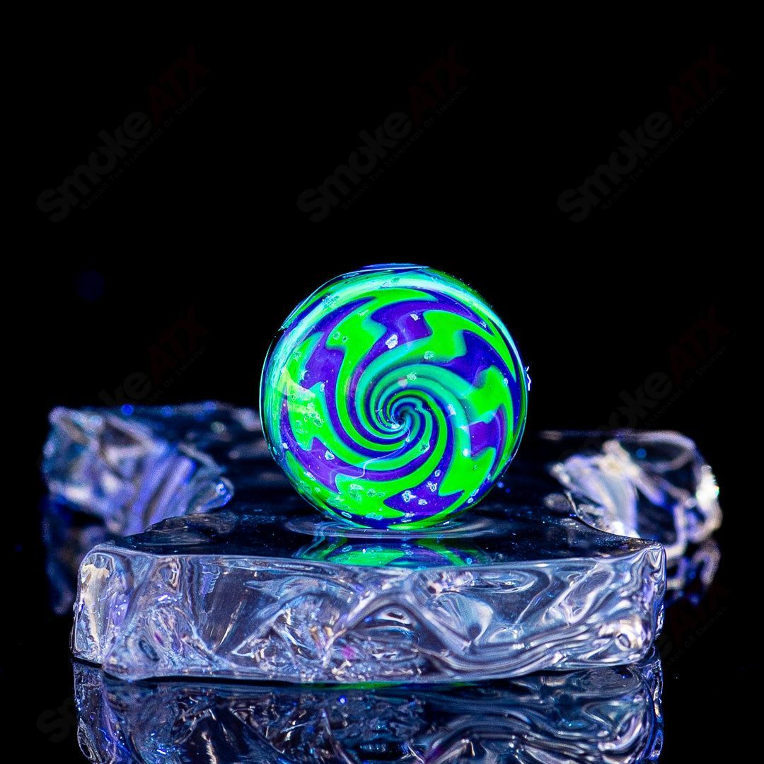 Colorful Dotstack w Crushed Opal UV Wags marble by Indo Glass, featuring vibrant glass marbles with crushed opal and UV-reactive effects.