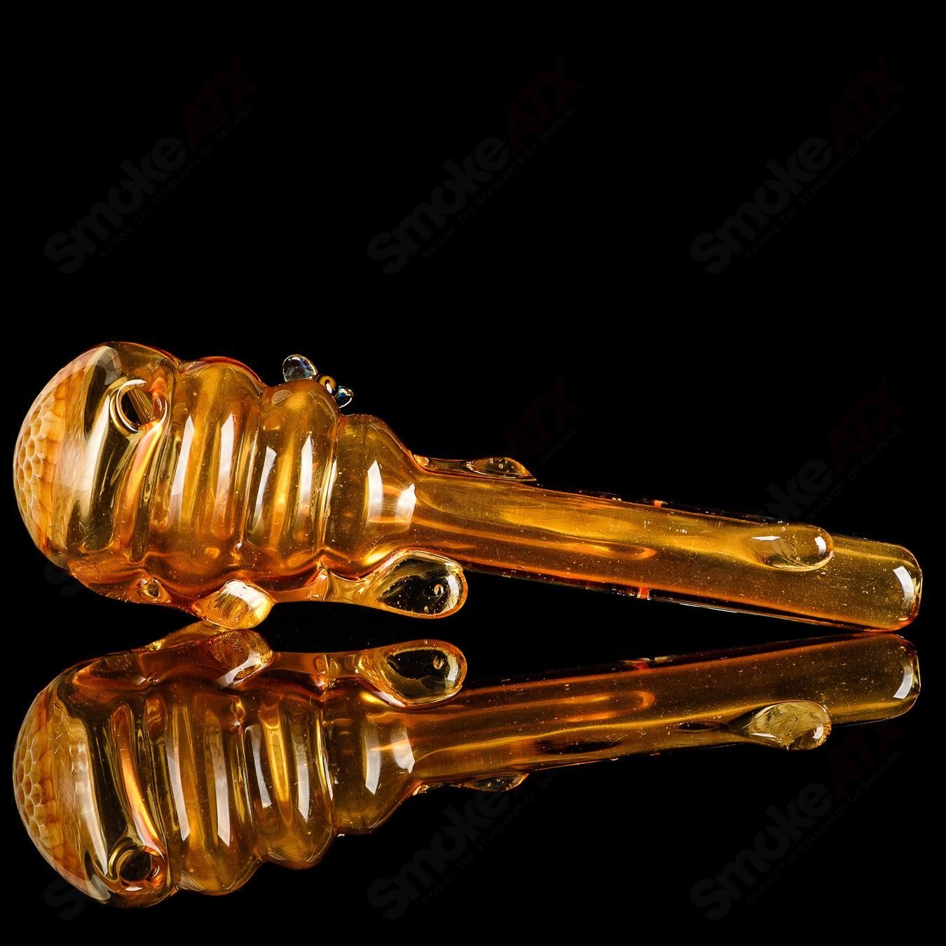 Joe P Glass Beehive Honeycomb Spoon Hand Pipe with intricate honeycomb design and clear glass finish.