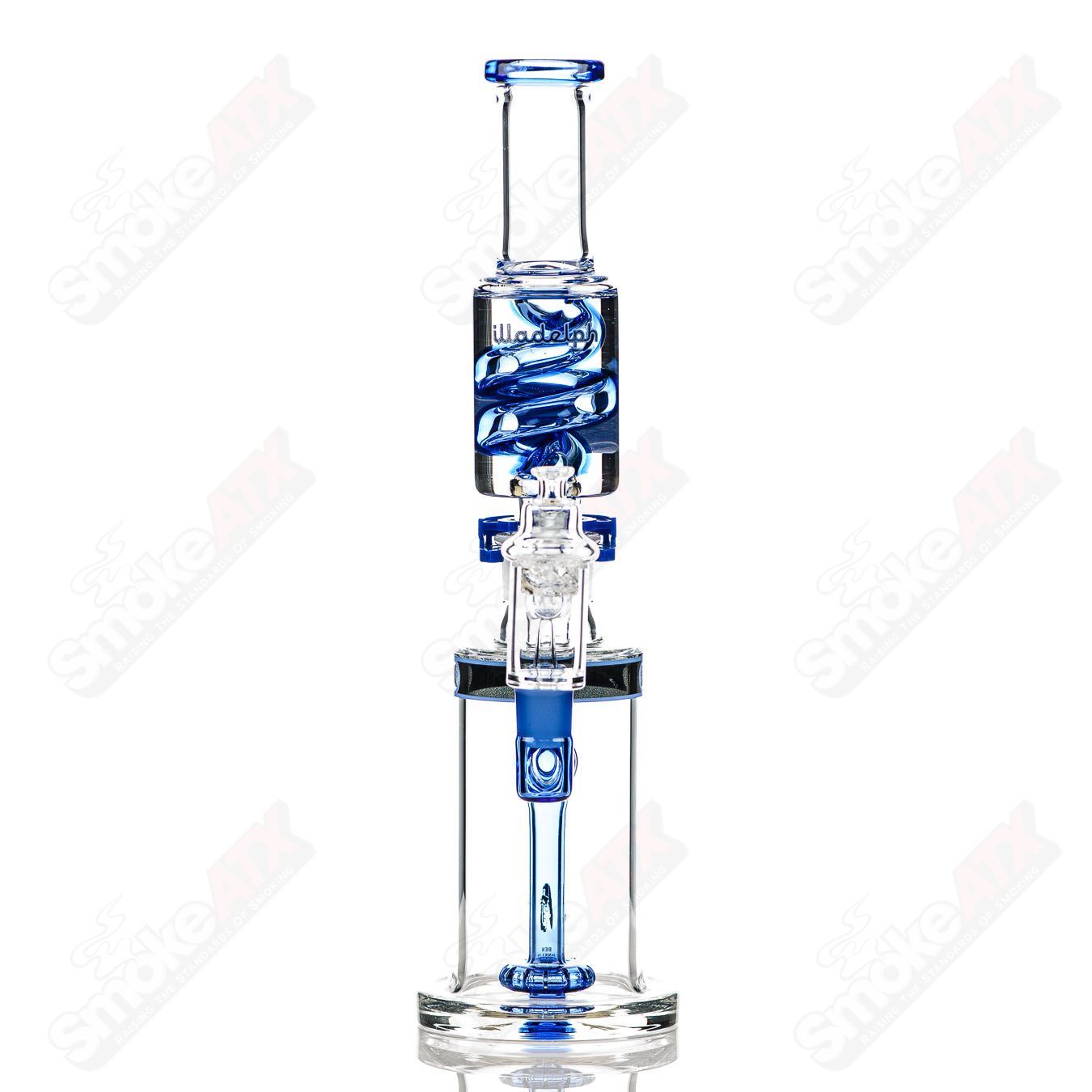 Sea blue glycerin coil bubbler by Illadelph, featuring intricate glass work and a smooth, curved design for easy handling.