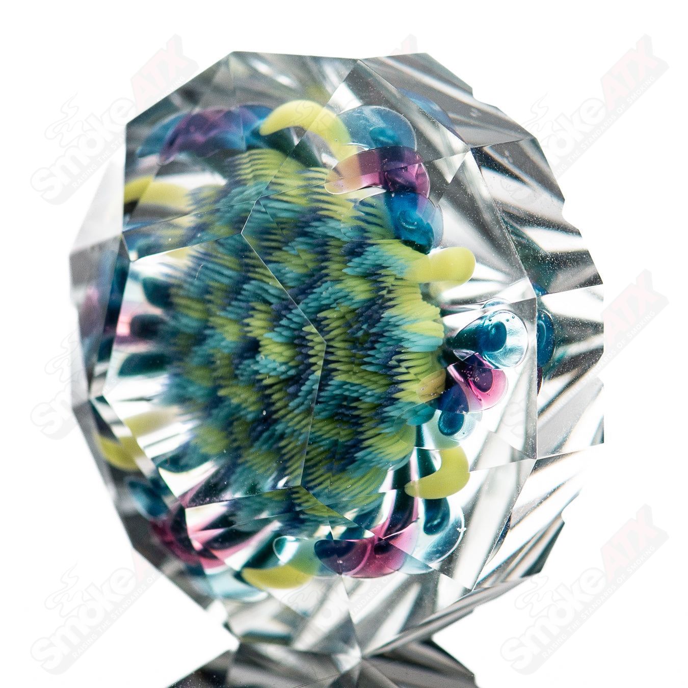 Big Gem Fatal Facets x Introvert Heady Glass marble with colorful, intricate patterns and a large, gem-like design.