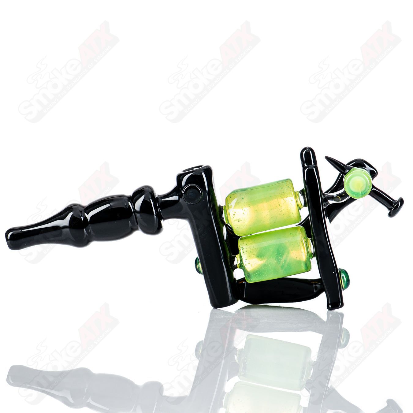 Black and slime-colored tattoo gun rig by JMass, a stylish heady glass concentrate rig with intricate design details.