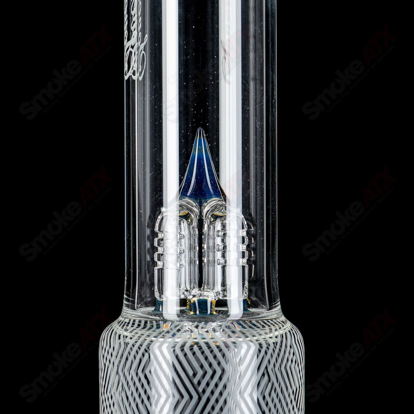 Heady glass bong with a straight neck, featuring Blasted Minor Deppe’s Darkness Peyote Hollow foot design by Sovereignty Glass.