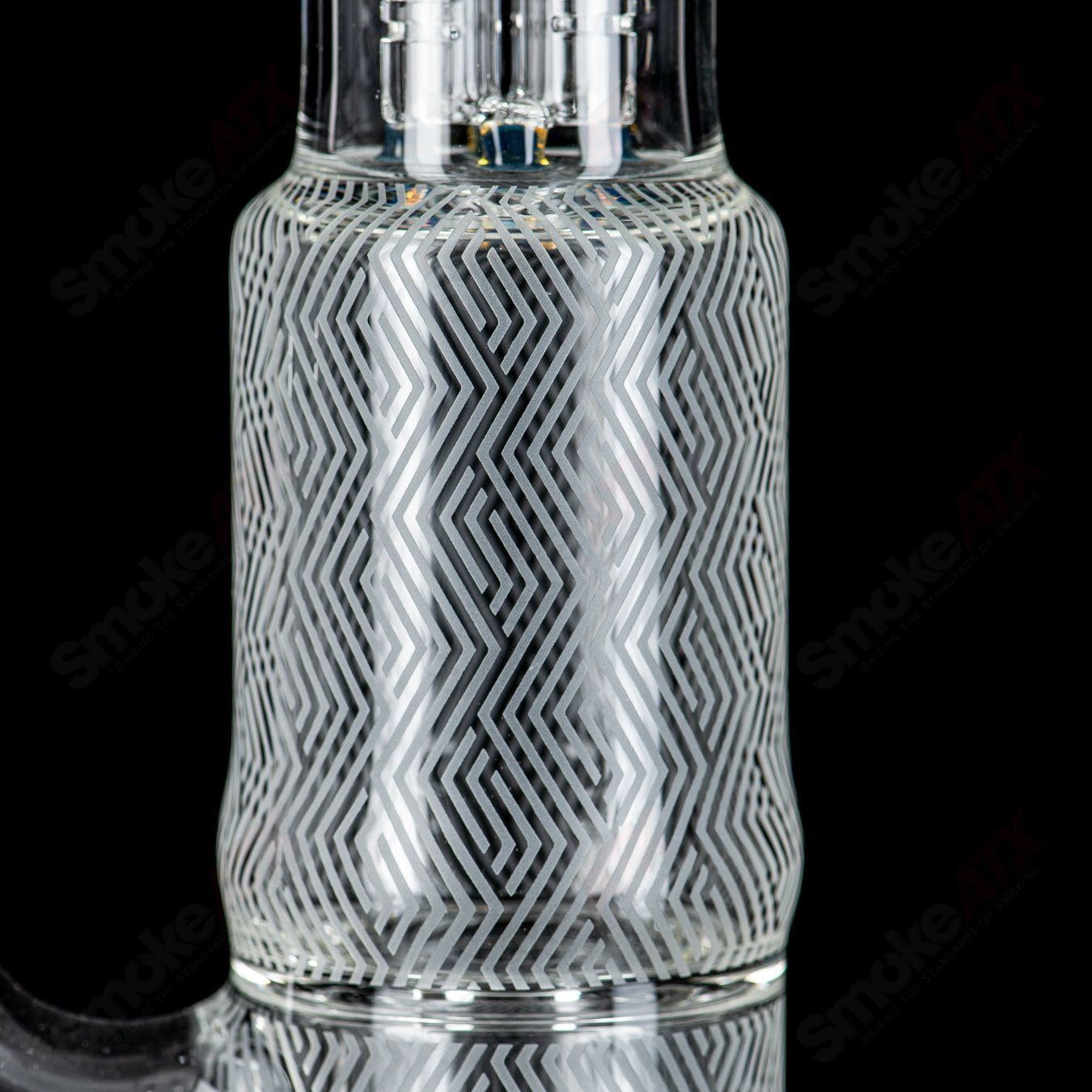 Heady glass pipe with a straight neck, vibrant peyote design, and hollow foot detail by Sovereignty Glass, Blasted Minor Deppe’s Darkness style.