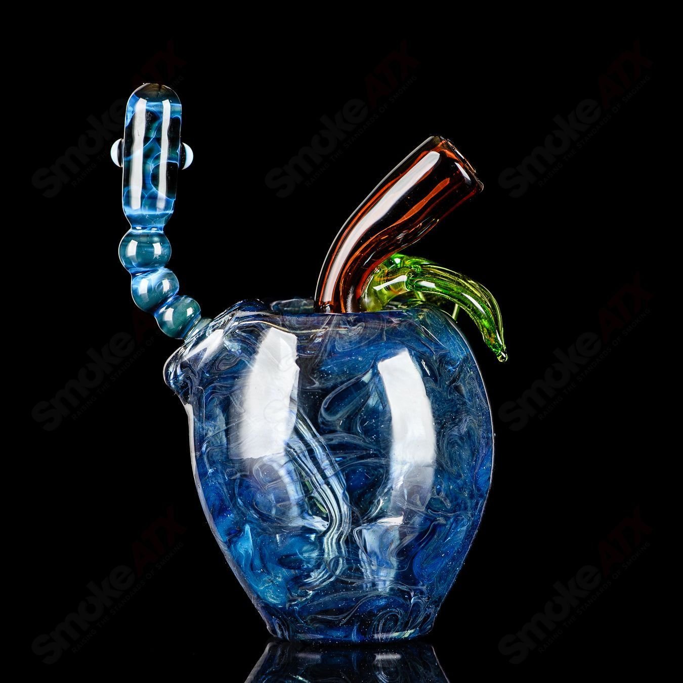 Blue apple-shaped rig with a worm dabber and matching pouch, crafted by Pouch Glass, designed for concentrate use.