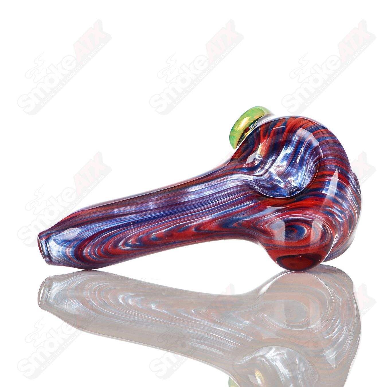 Blue and red worked glass spoon pipe with slyme accent and carb, signed by JMK Glass, featuring intricate hand-crafted details.