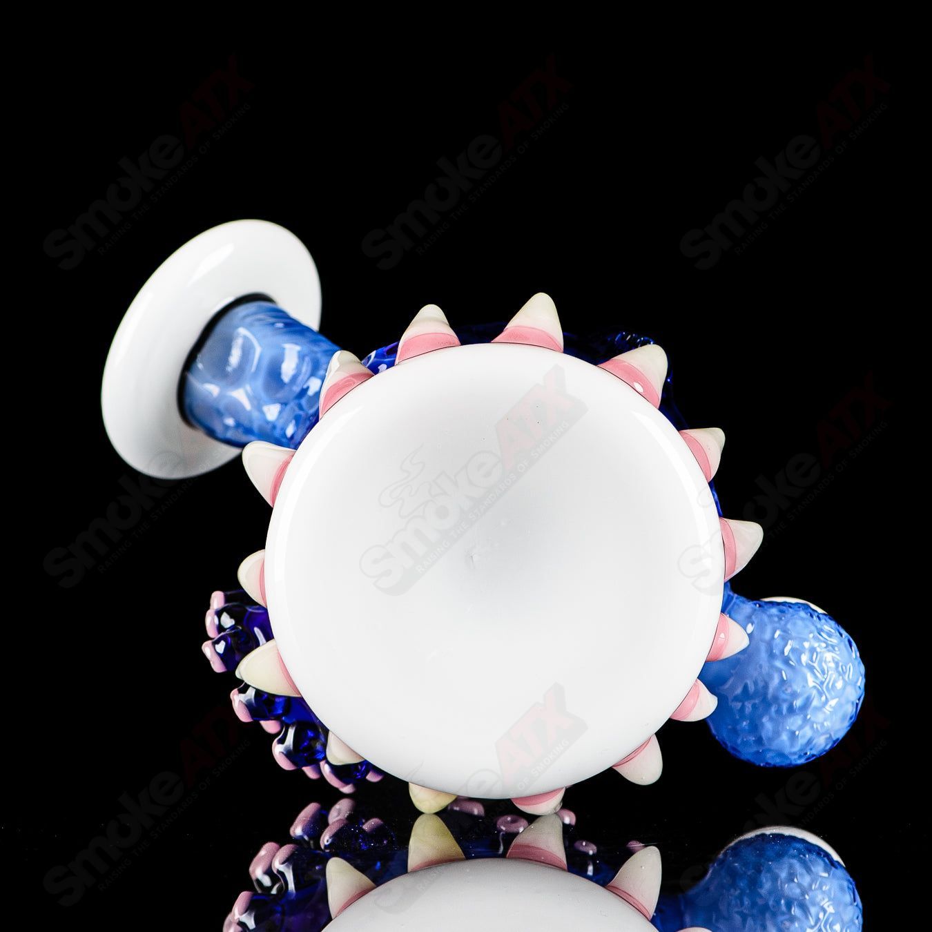 Brilliant blue ORB Rig by Salt & JAG, a glass concentrate rig with a spherical design and vibrant blue color.