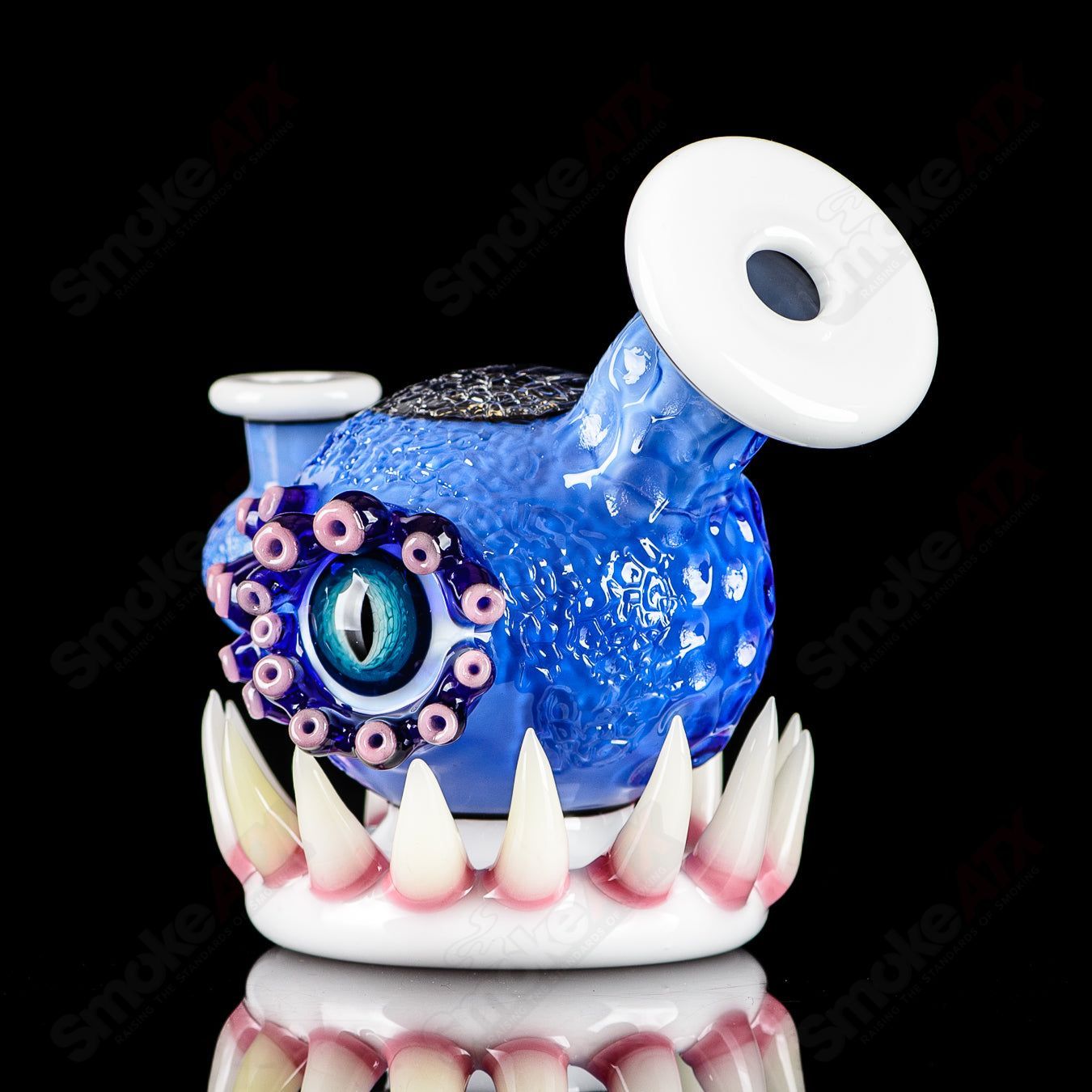 Brilliant blue ORB rig by Salt JAG, a glass concentrate rig featuring a vibrant blue design and intricate glasswork.