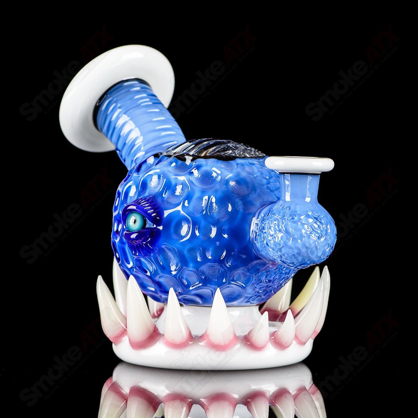 Brilliant blue orb rig by Salt & JAG for concentrate use, featuring a spherical design and clear glass accents.
