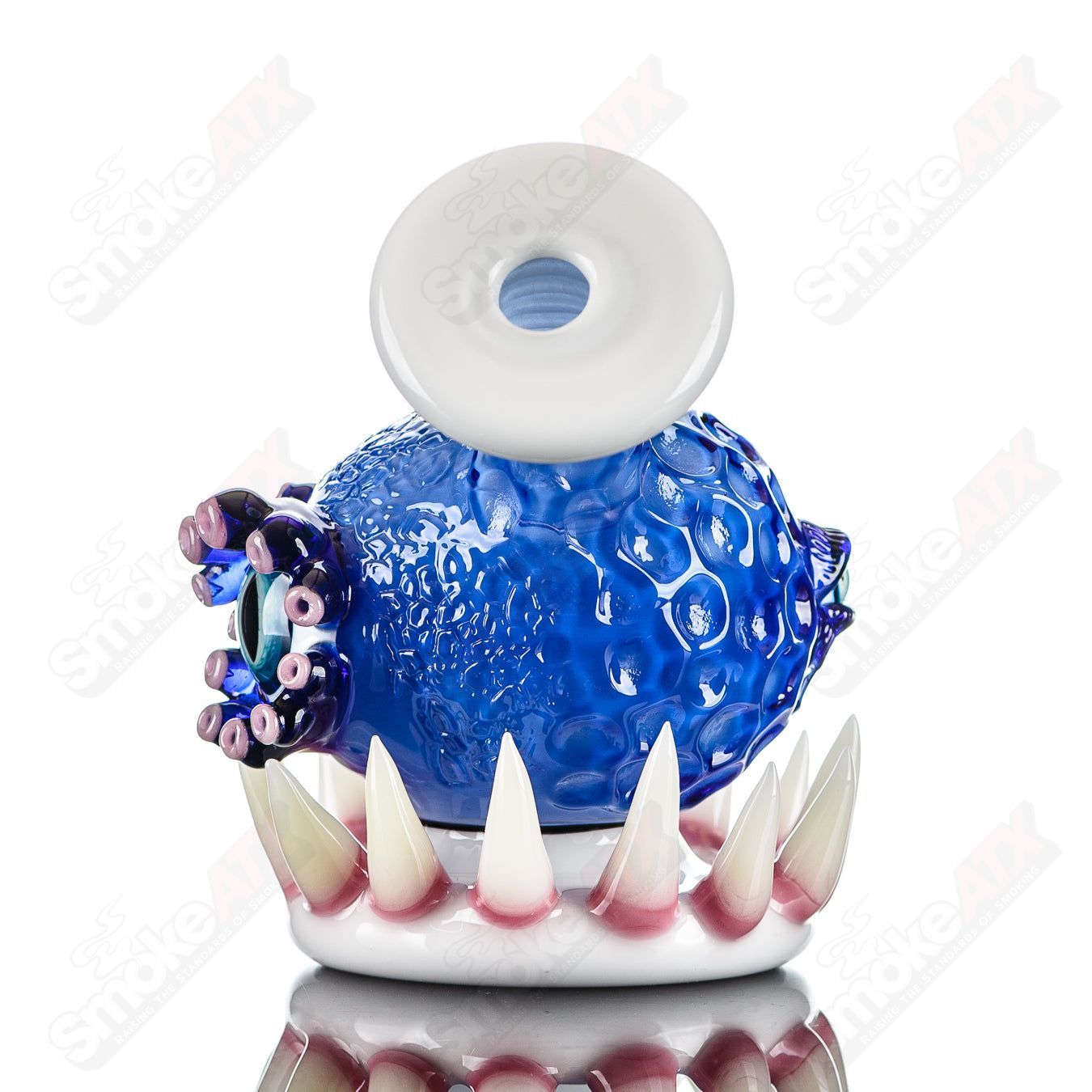Brilliant blue Orb Rig by Salt & JAG, a high-quality glass concentrate rig with a vibrant blue spherical design.
