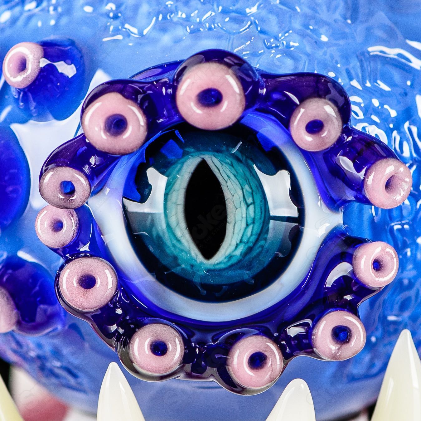 Brilliant blue Orb Rig by Salt & JAG, a heady glass concentrate rig with a spherical design and vibrant blue color.