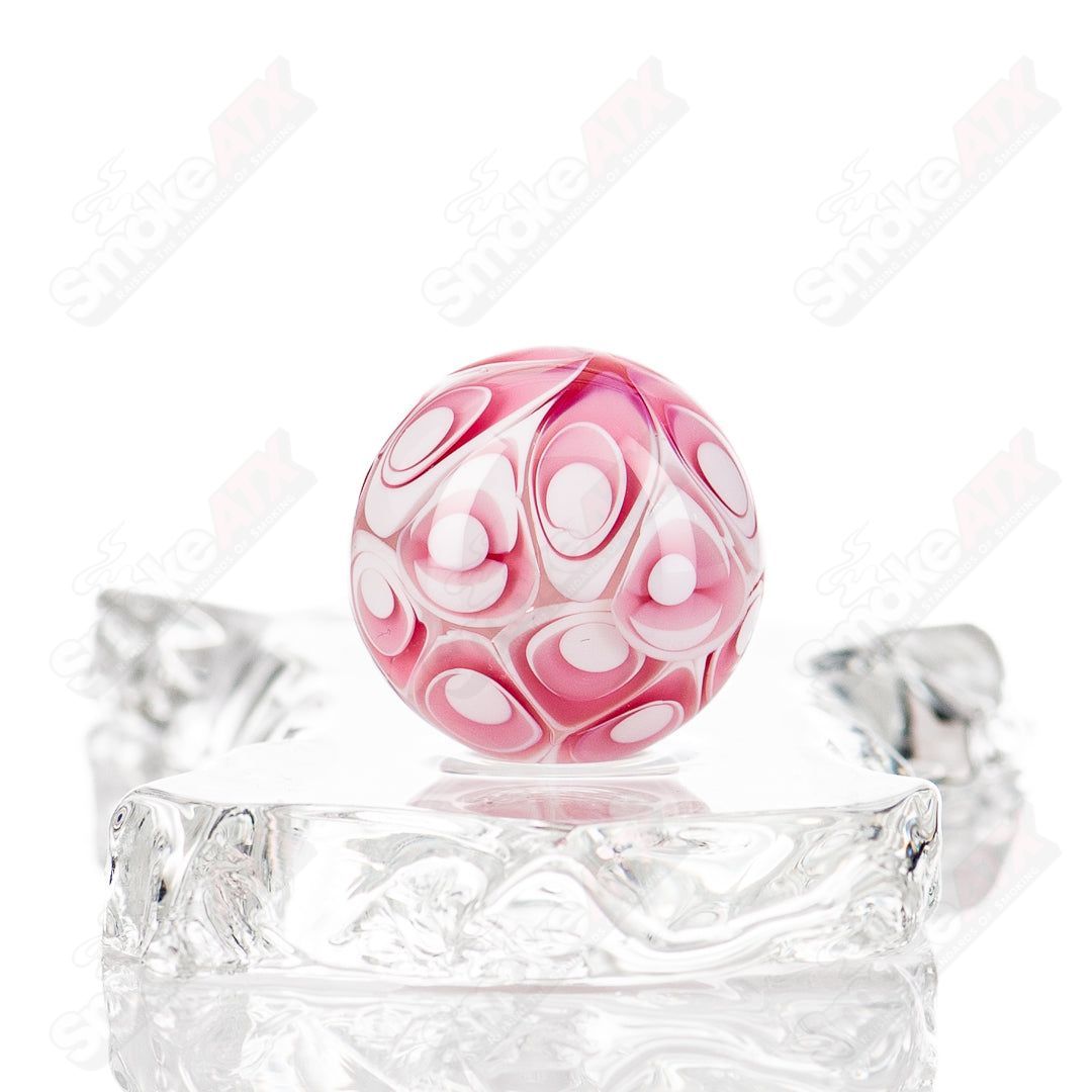 Gold ruby dotstack marble from Indo Glass, clear glass with colorful ruby and gold dot patterns, traditional decorative marble.
