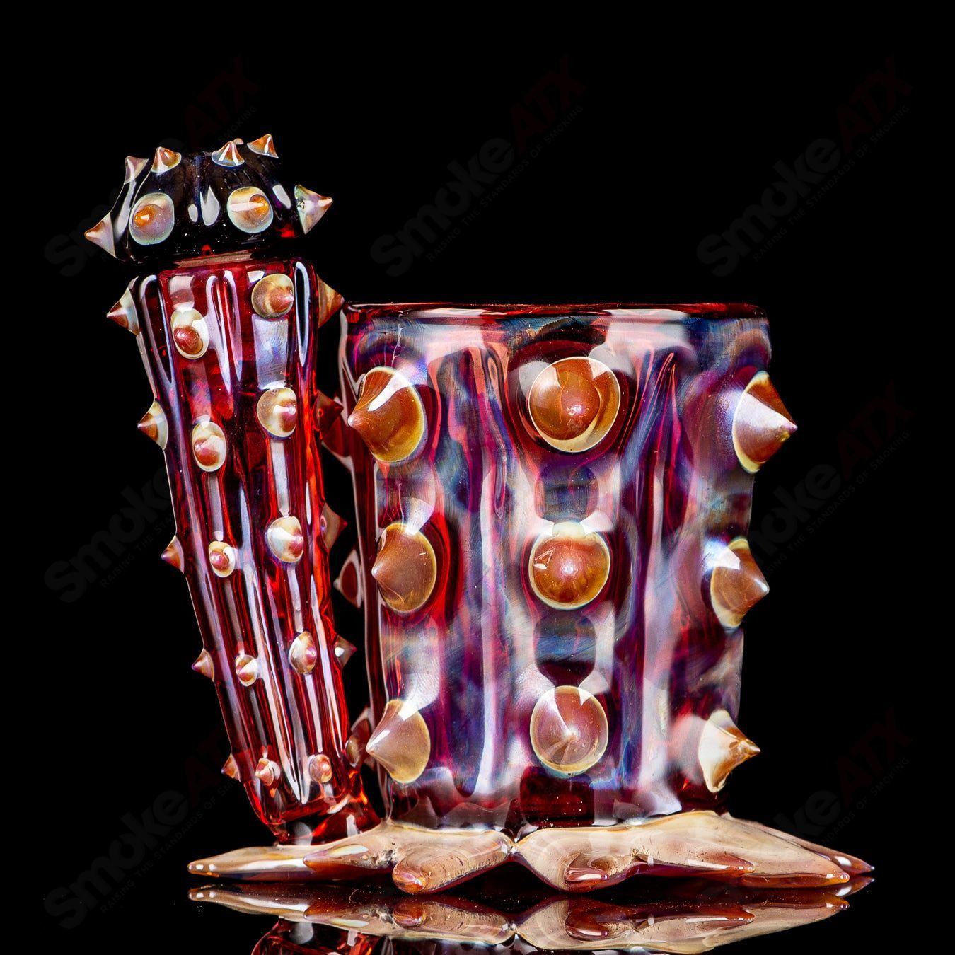 Red cactus-shaped Iso/Qtip jar by Unparalleled Glass, a unique heady glass piece with intricate design and vibrant color.
